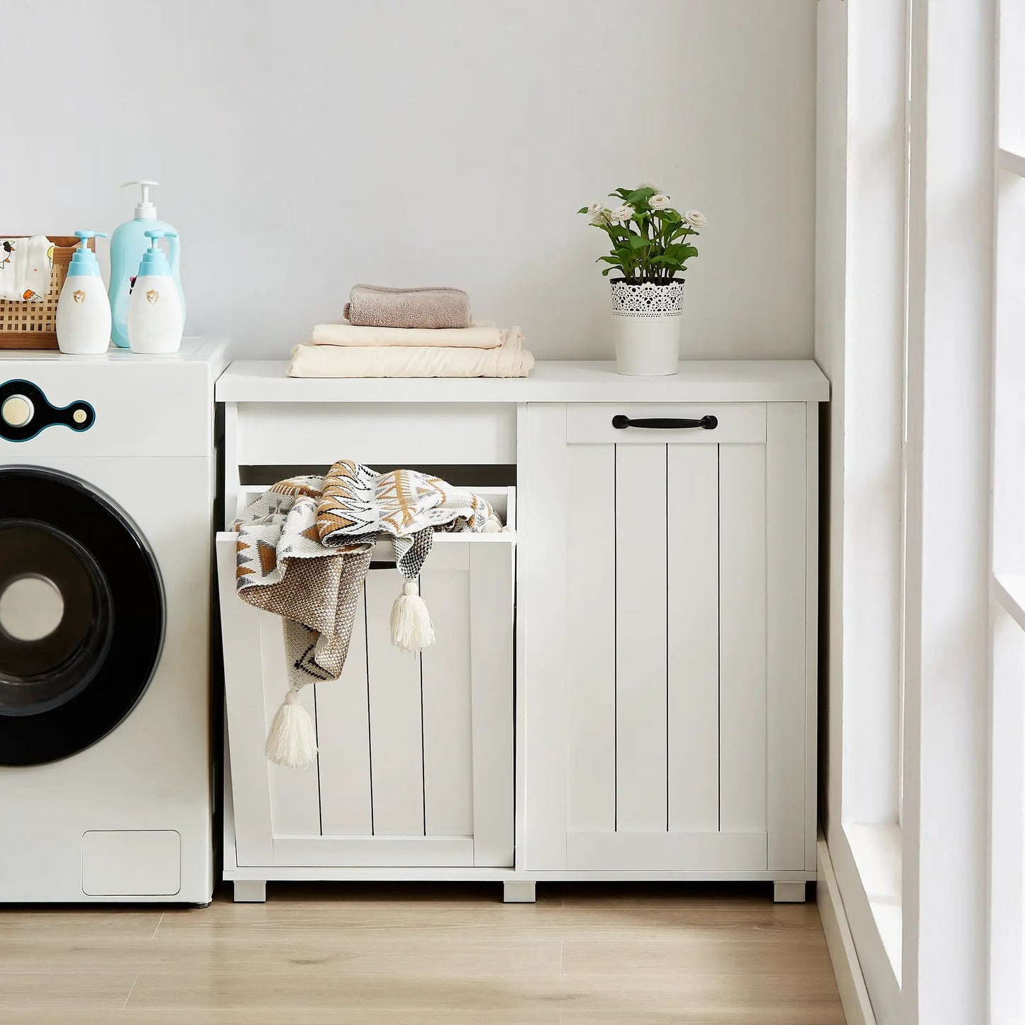 White two-compartment tilt-out trash cabinet with pet-proof design on Tampa Home & Garden Store