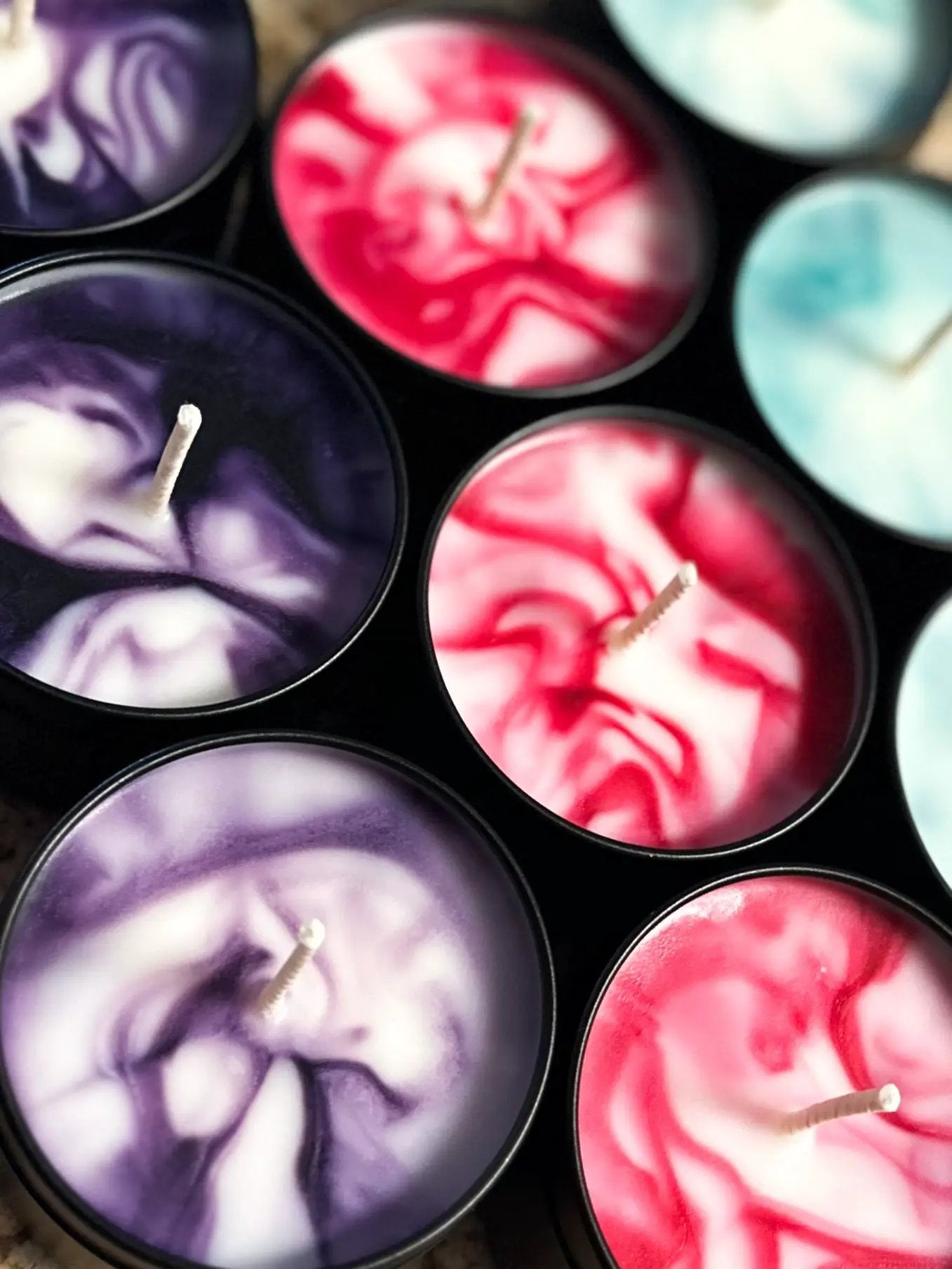 Dragon Rider candle apricot green notes and pear in marbled purple, red, pink and teal tins on Tampa Home & Garden Store