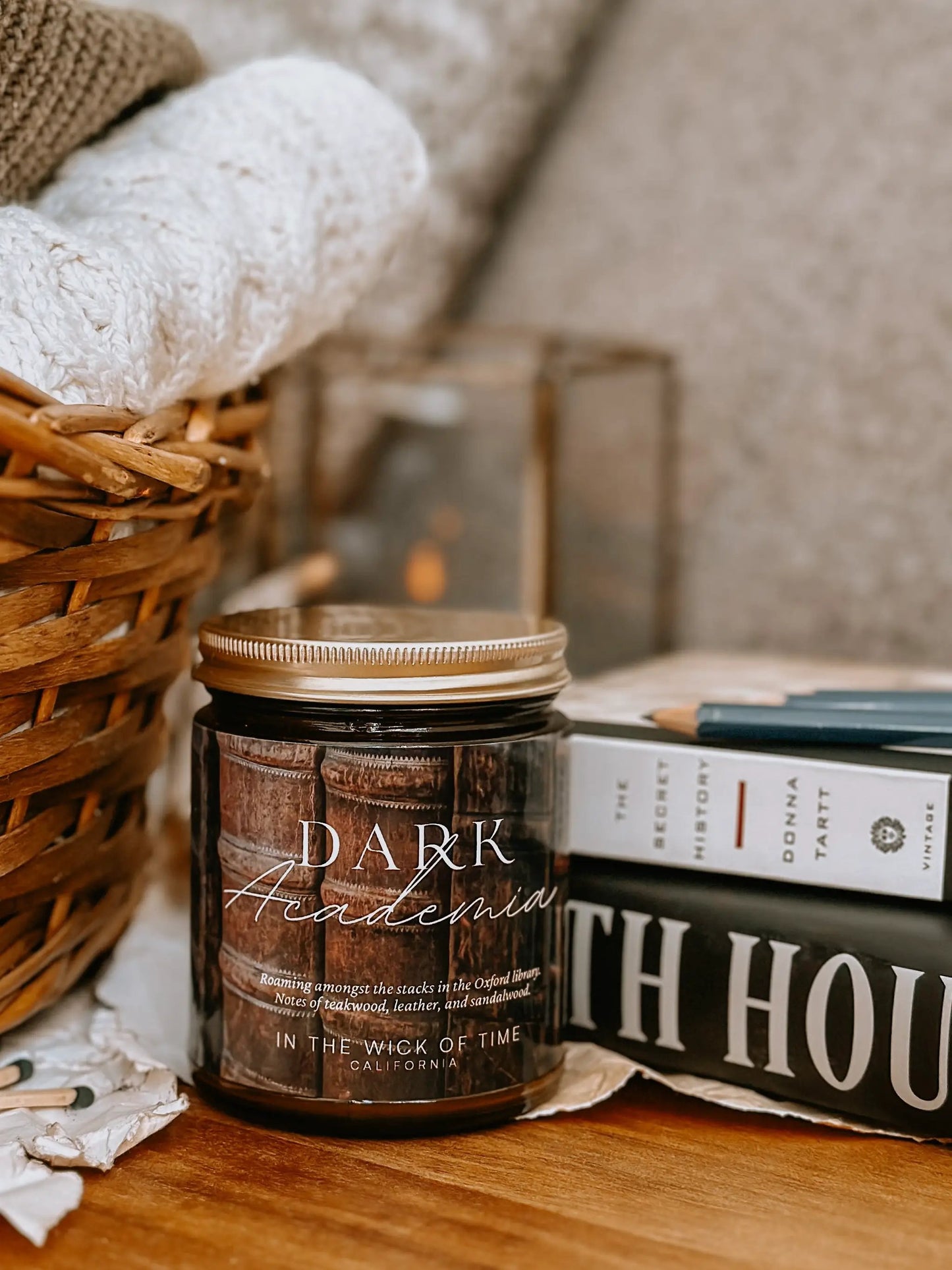 Dark Academia Candle by In the Wick of Time in a dark glass jar with a gold lid on Tampa Home & Garden Store