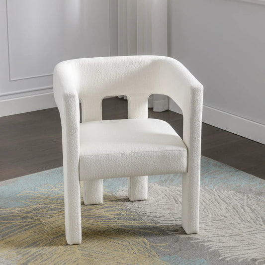 Beige fabric upholstered accent dining chair, textured boucle, curved back, pair on rug on Tampa Home & Garden Store