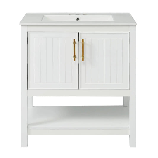 Elegant white bathroom vanity with ceramic sink and beadboard cabinet doors, gold handles on Tampa Home & Garden Store