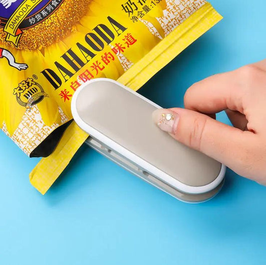 Mini bag sealer by VIP Digital Presence, compact silver handheld tool for chip and plastic bags on Tampa Home & Garden Store