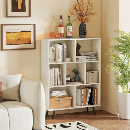 White 7-Cube Bookcase with tapered black metal legs styled with books and decor on Tampa Home & Garden Store