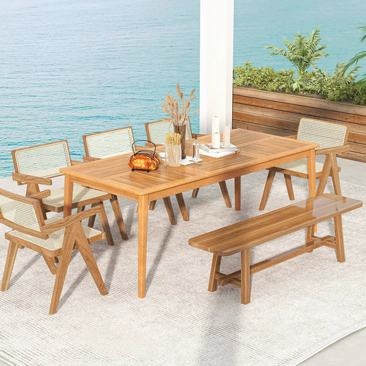 8-person outdoor acacia wood dining table with matching caned-back chairs and a bench on Tampa Home & Garden Store