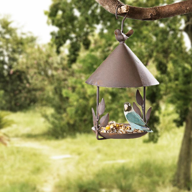 American-made old wrought iron bird feeder with cone roof, seed tray, blue bird perched inside on Tampa Home & Garden Store