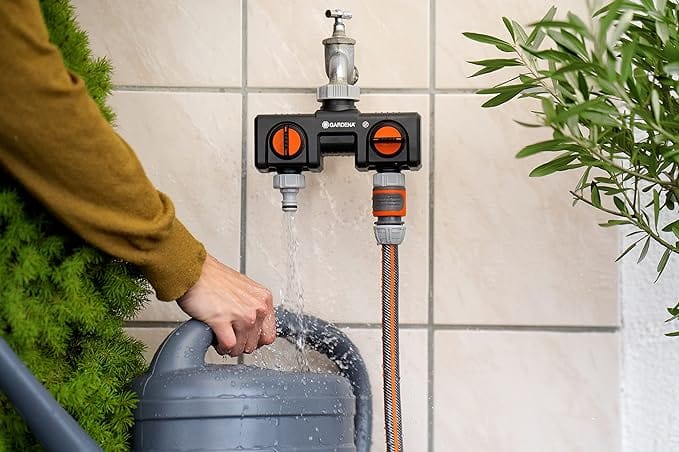 Gardena two-way faucet adapter with black body and orange valve dials, hose connections on Tampa Home & Garden Store