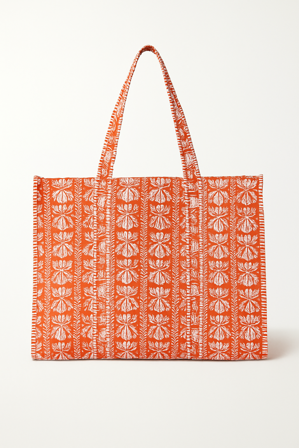 Orange Marigold Tote bag by Erin Donahue Tice with white floral pattern on orange fabric on Tampa Home & Garden Store
