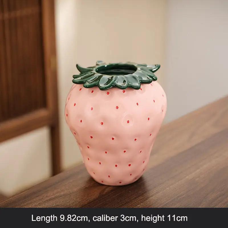 Strawberry-shaped ceramic vase pink with green leafy rim for flower arrangements on Tampa Home & Garden Store