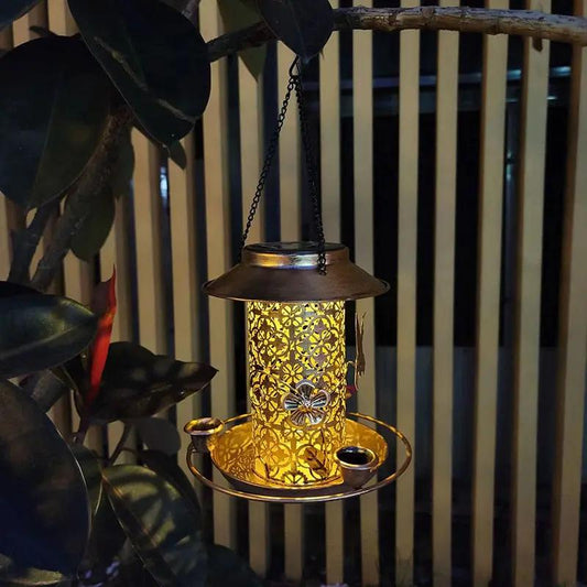 Outdoor solar lantern bird feeder with gold lattice metal and seed cups on Tampa Home & Garden Store