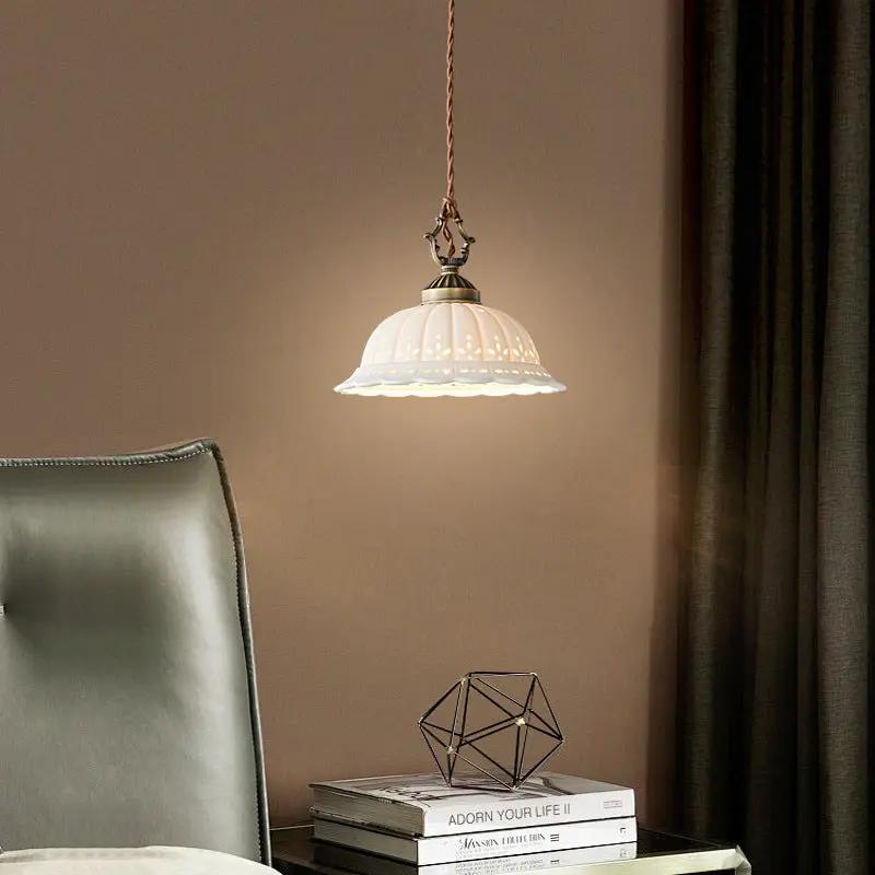 Copper bedside pendant light with white perforated shade and twisted cord on Tampa Home & Garden Store
