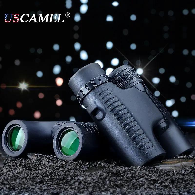 USCAMEL 10x26 binoculars long-range zoom black pair with green lenses on rocky ground on Tampa Home & Garden Store