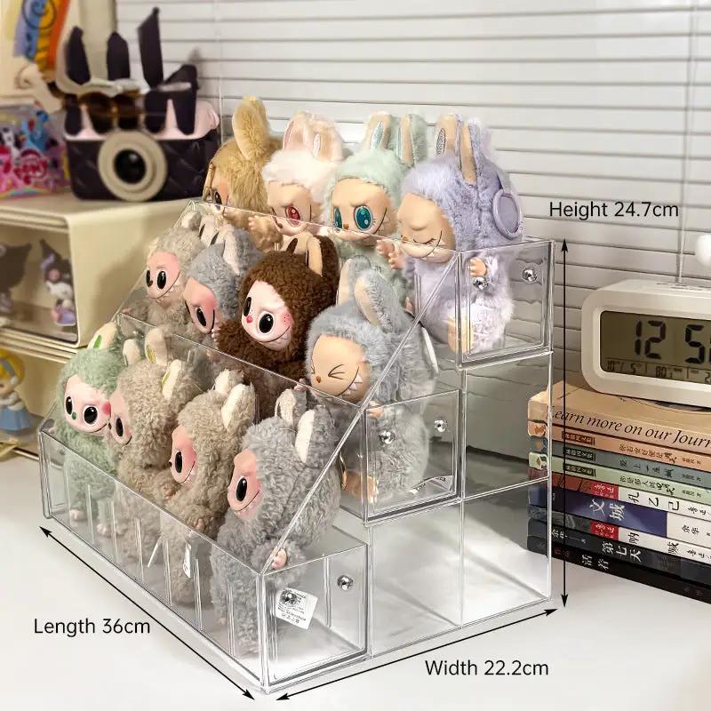 Clear 3-tier acrylic display shelf with Labubu plush dolls; transparent storage rack on Tampa Home & Garden Store