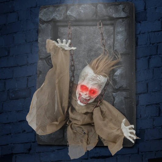 Halloween Hanging Zombie Prisoner Decoration with red eyes and burlap robes, chains on Tampa Home & Garden Store