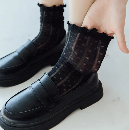 Women’s black mesh tube socks with Japanese lace and ruffled top, worn with black loafers on Tampa Home & Garden Store