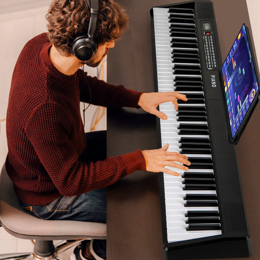 Black 88-key foldable digital piano with MIDI, tablet display on stand on Tampa Home & Garden Store