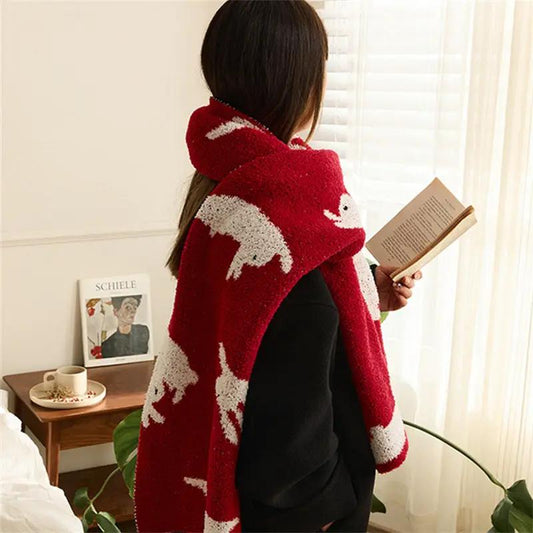 New Year rabbit blanket scarf in red with white rabbit pattern draped over a person on Tampa Home & Garden Store