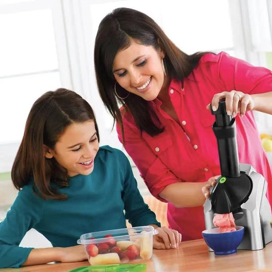 Electric ice cream and yogurt maker with black-silver body and green power button in use on Tampa Home & Garden Store