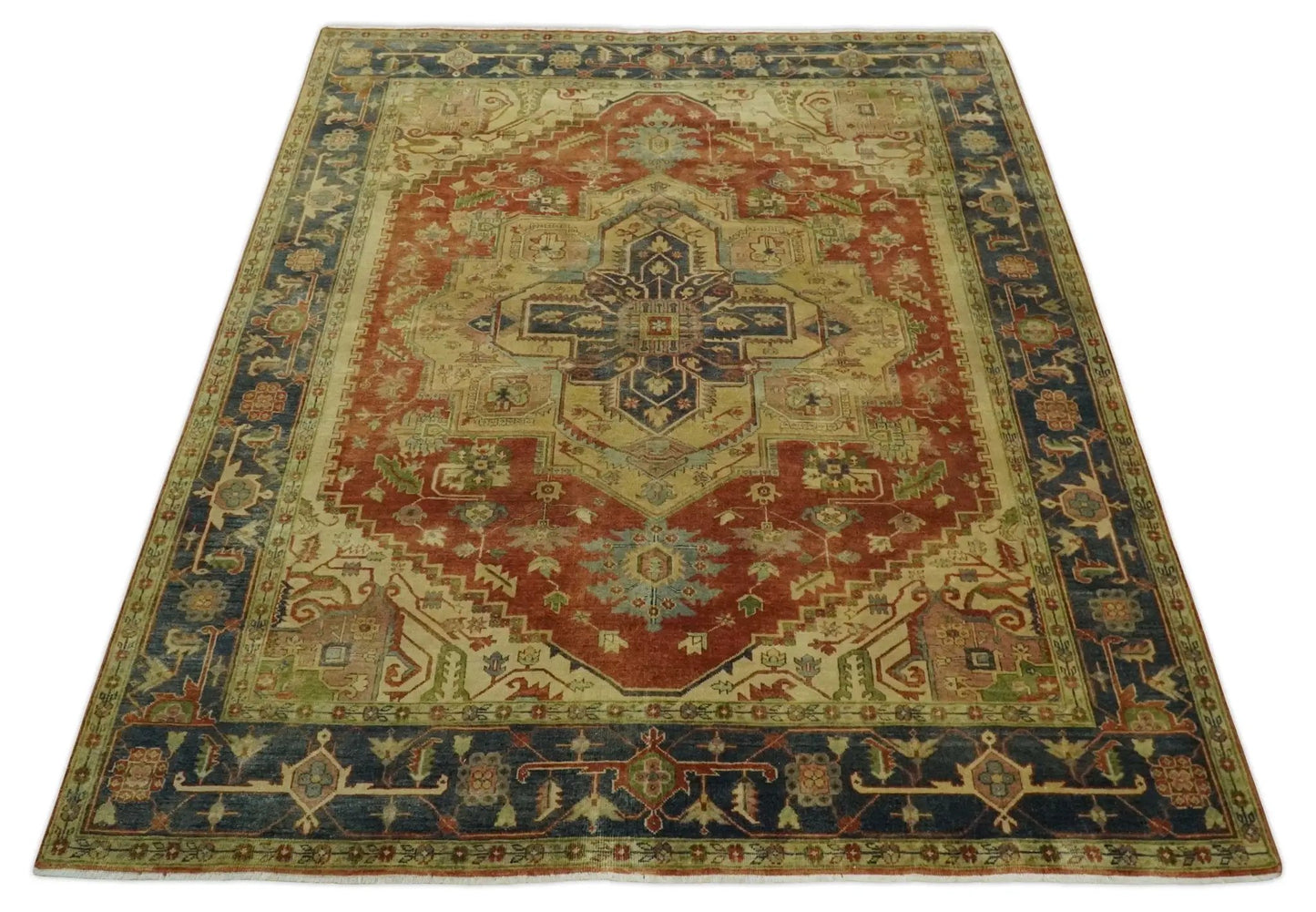 Heriz Serapi hand-knotted wool area rug with red field, ivory motifs, and blue border on Tampa Home & Garden Store