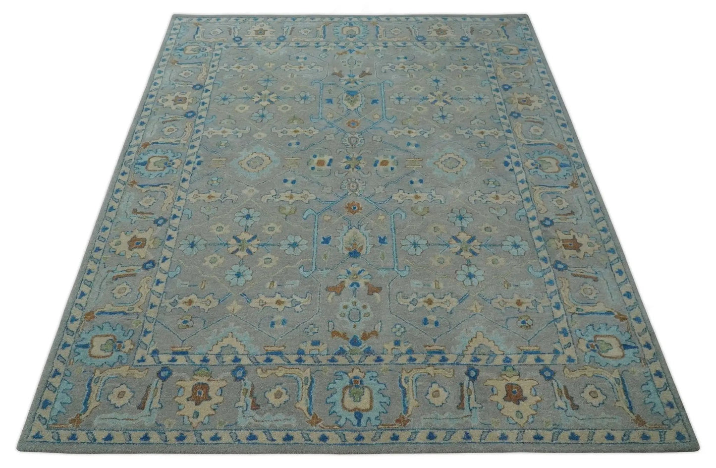 8x10 hand tufted wool area rug in gray beige with blue Herati motifs on Tampa Home & Garden Store