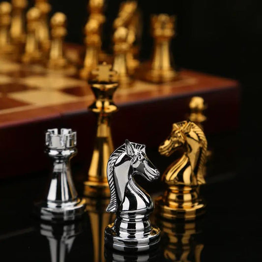 International Chess Gift Box with Metal Pieces silver knight and gold horse on chessboard on Tampa Home & Garden Store