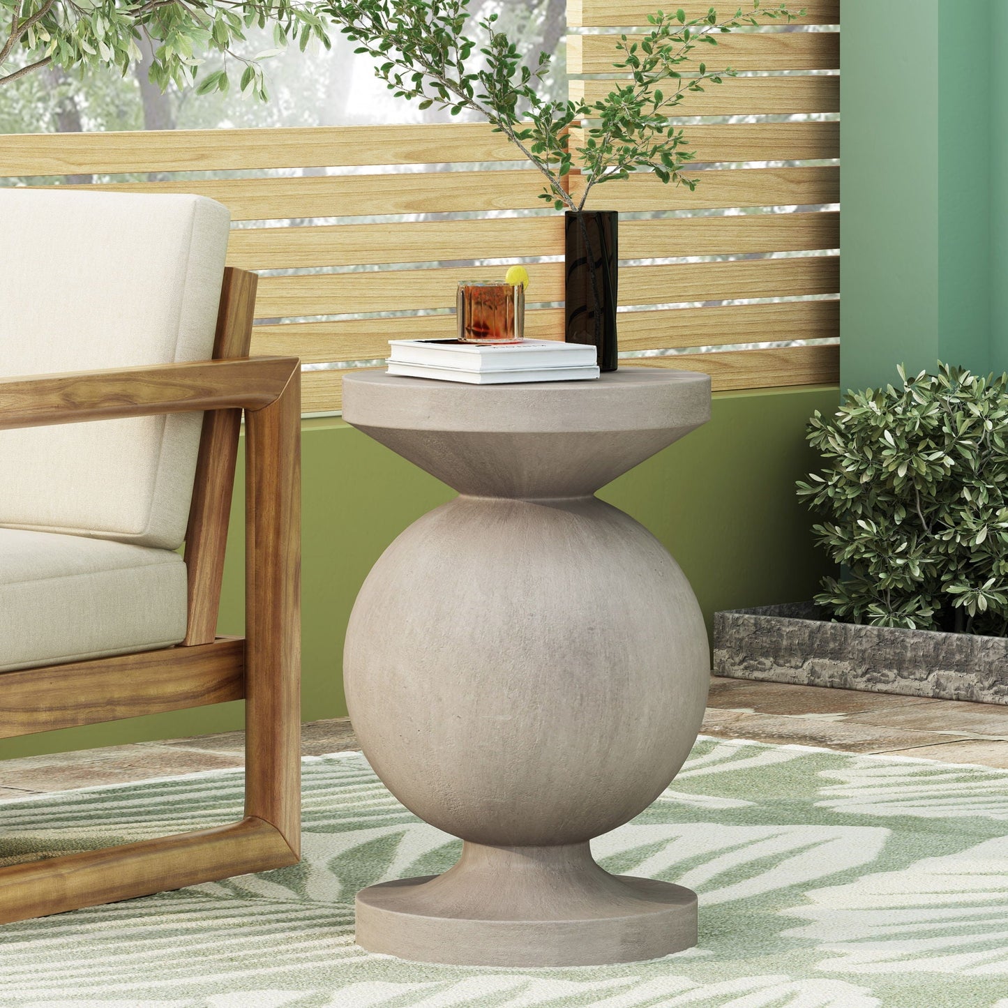 End Table Outdoor Natural by HouseOfZazla with rounded pedestal base beside beige outdoor chair on Tampa Home & Garden Store