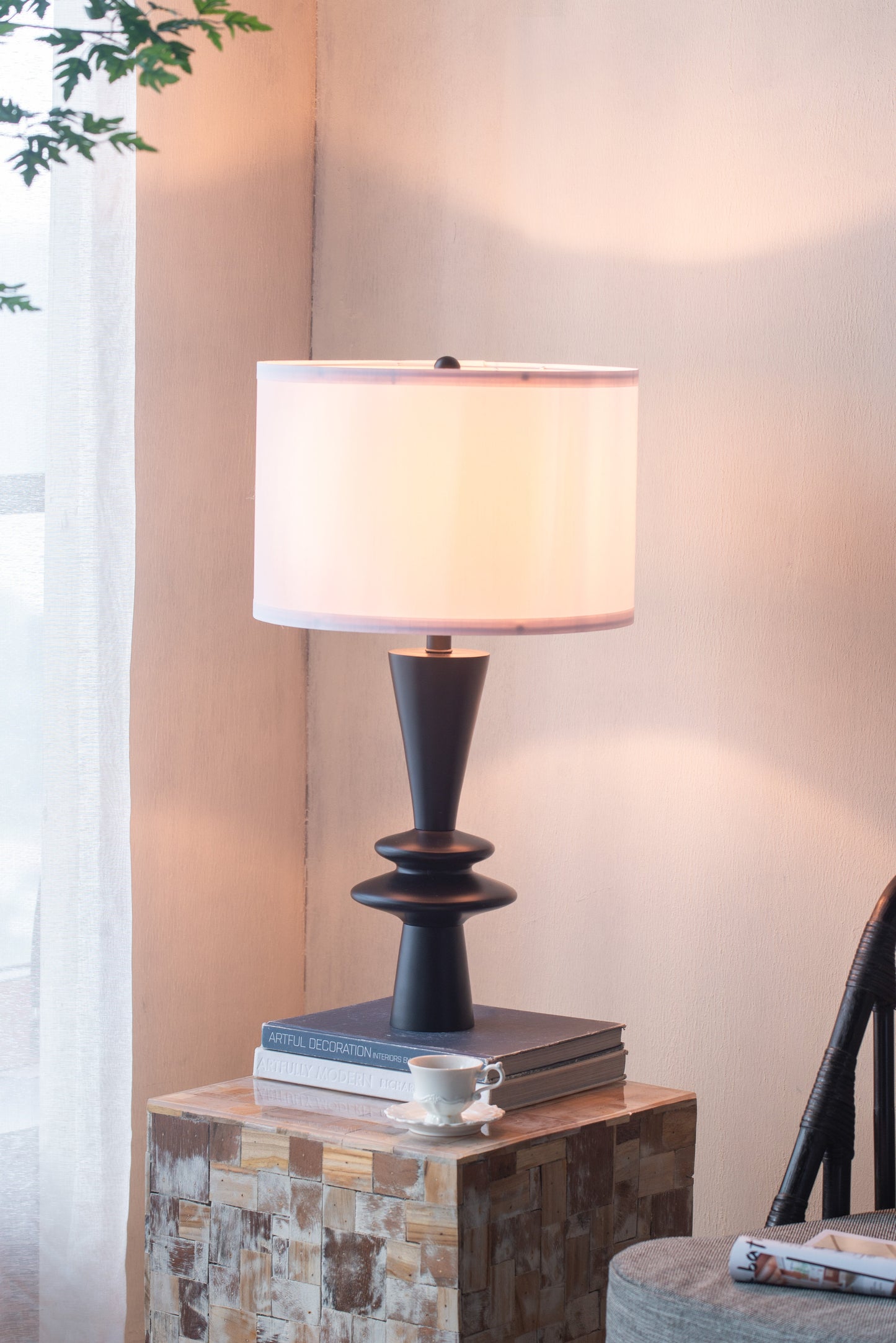 D15x26.7in table lamp with black pedestal base and white drum shade on a wood block table on Tampa Home & Garden Store