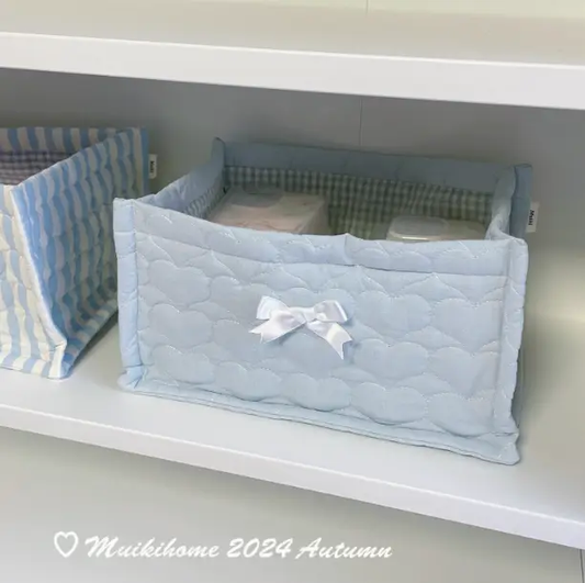 Two light-blue quilted desktop storage baskets with white bow for desk organization on Tampa Home & Garden Store