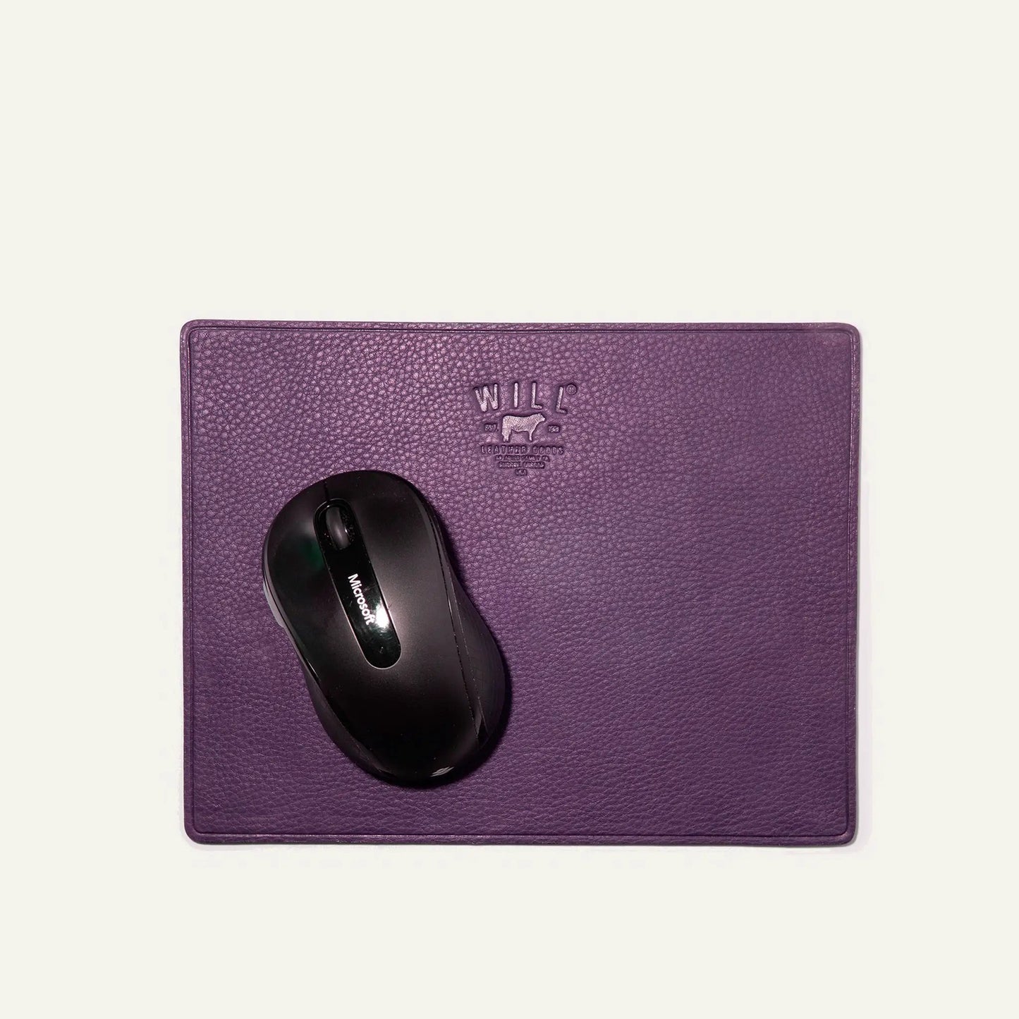 Leather mouse pad by Will Leather Goods in purple with embossed logo and a mouse on Tampa Home & Garden Store