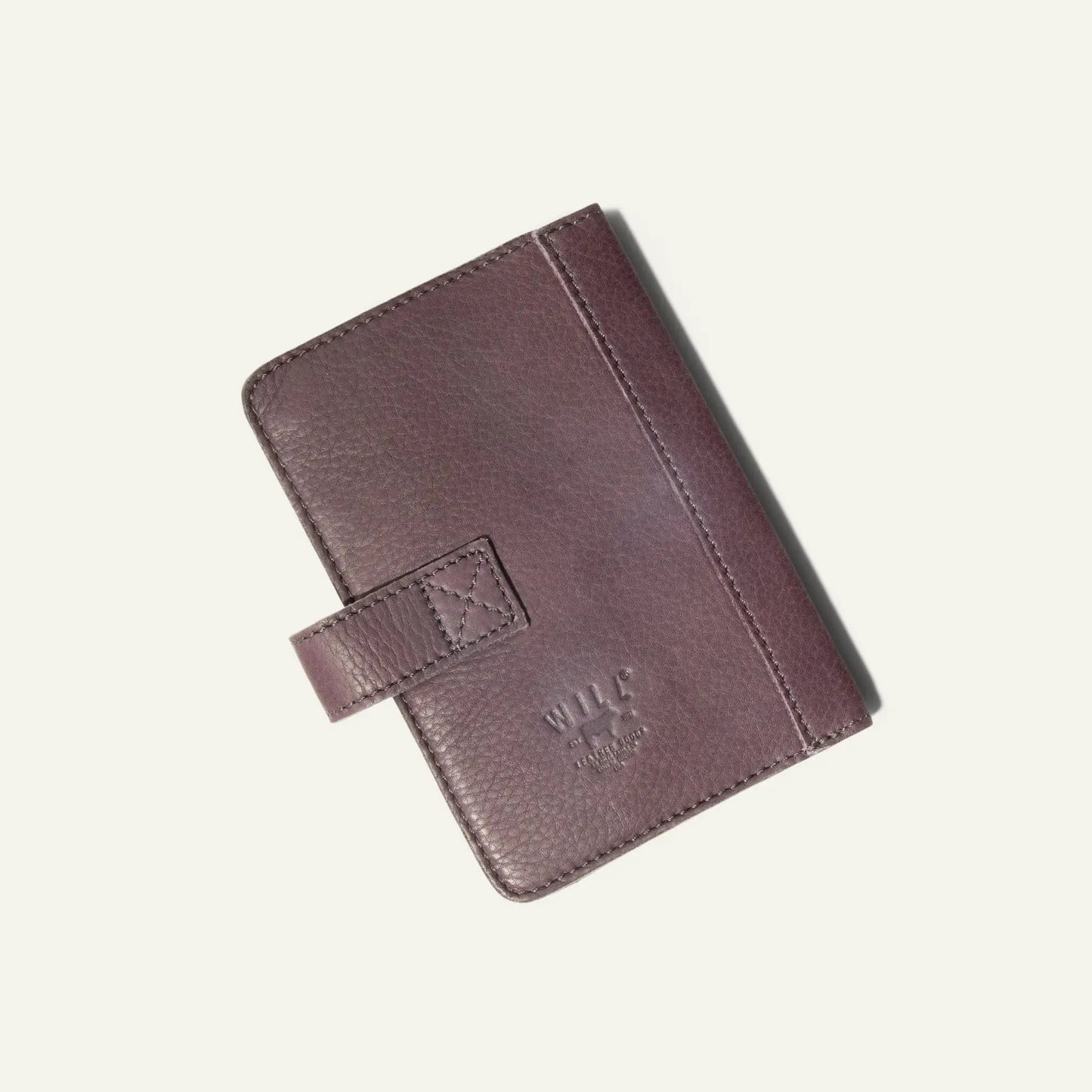 Small Leather Journal Cover for Passport in plum with stitching and Will Leather Goods embossing on Tampa Home & Garden Store
