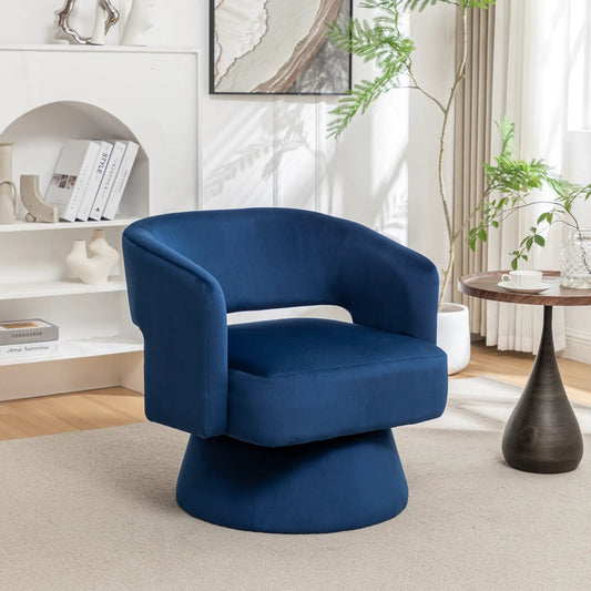 Blue velvet 360-degree swivel barrel armchair in a modern living room with white shelving on Tampa Home & Garden Store
