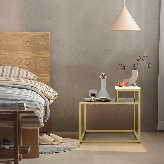 2-Tier end side table with yellow metal frame and grey shelves in bedroom with vase and glassware on Tampa Home & Garden Store