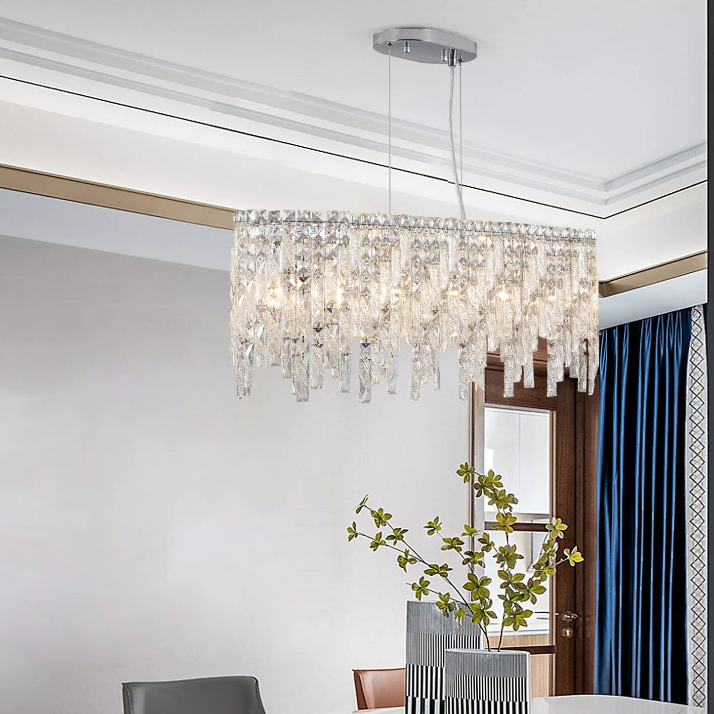 Silver oval crystal pendant light with crystal prisms, suspended from round ceiling canopy on Tampa Home & Garden Store