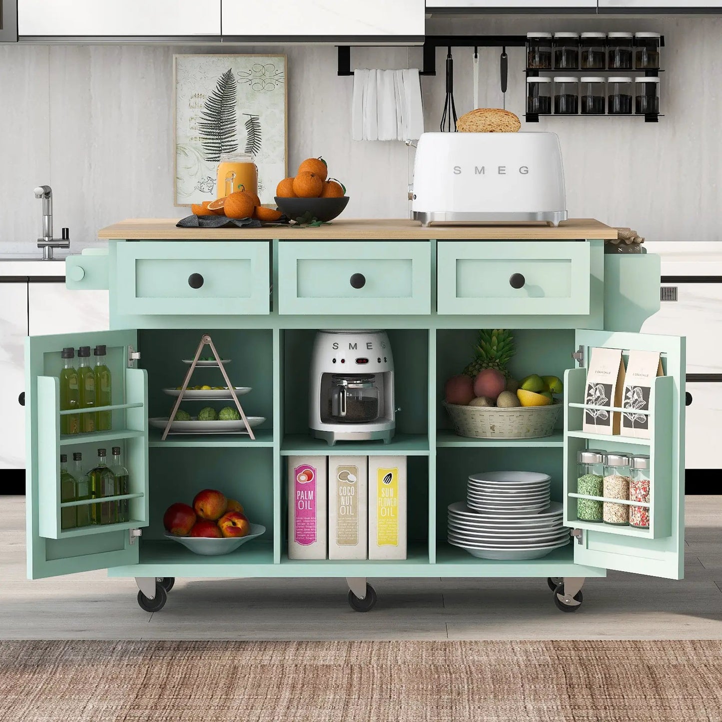 Mint green kitchen cart with drop-leaf wood countertop; SMEG toaster, fruit bowl on Tampa Home & Garden Store