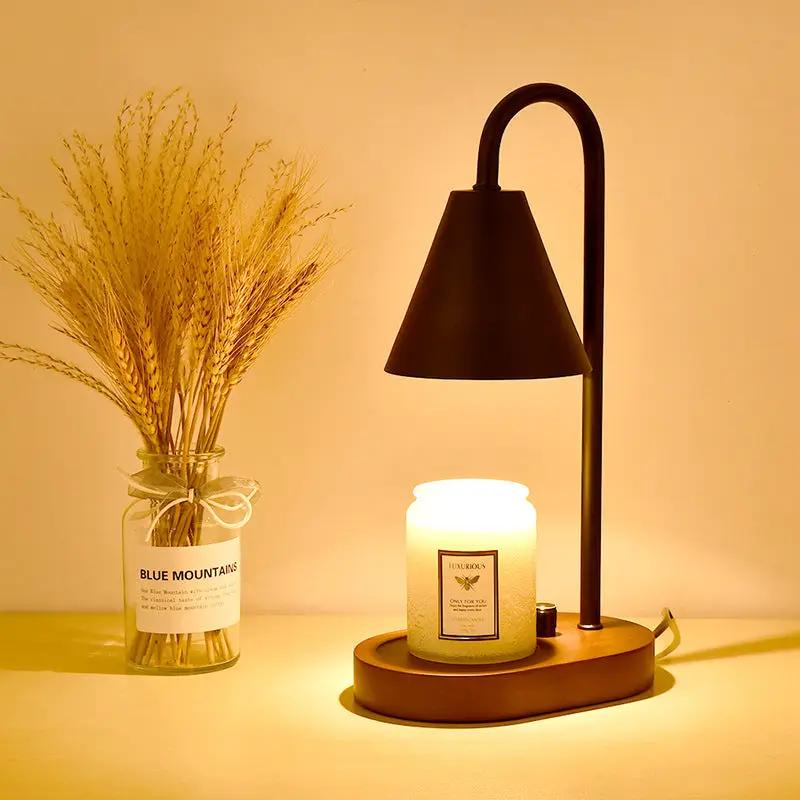 Nordic Aromatherapy Wax Melting Lamp for Bedroom featuring black arc stand and warm candle on wood base; dried grasses vase beside 2-piece display on Tampa Home & Garden Store