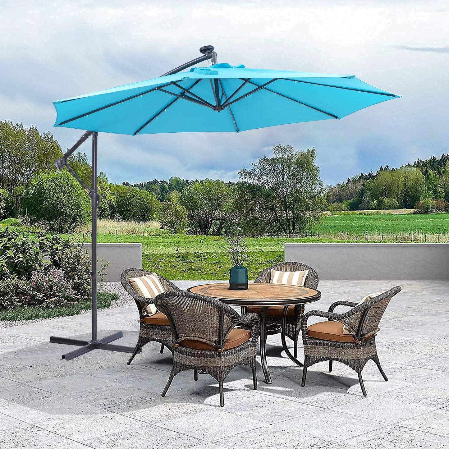 Blue 10 ft solar LED patio umbrella with 32 lights over outdoor wicker dining set on Tampa Home & Garden Store