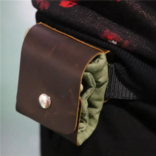 Outdoor foraging waist bag with brown leather flap and olive green fabric interior on Tampa Home & Garden Store