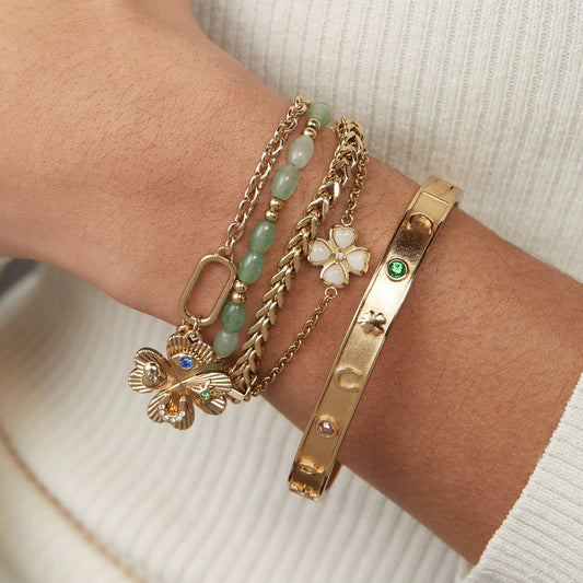 Lucky Hinge Bangle with gold-tone links and green beads, floral charm on Tampa Home & Garden Store