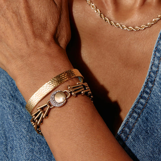 Wanderer Chain Statement Bracelet by ALEX AND ANI with layered gold-tone bangles on denim backdrop on Tampa Home & Garden Store