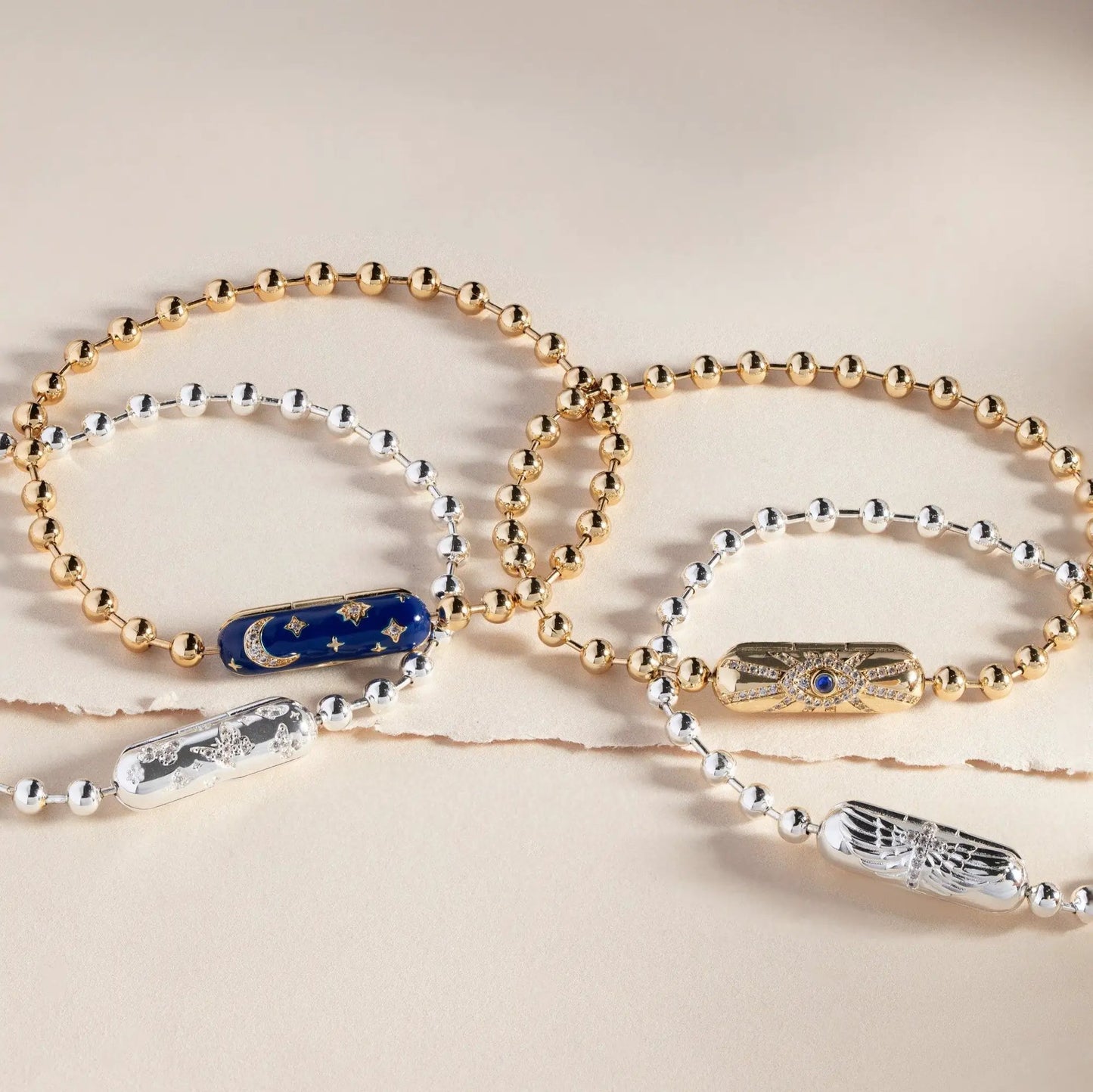 Bracelet collection of gold-tone and silver-tone beaded chains with enamel accents on Tampa Home & Garden Store