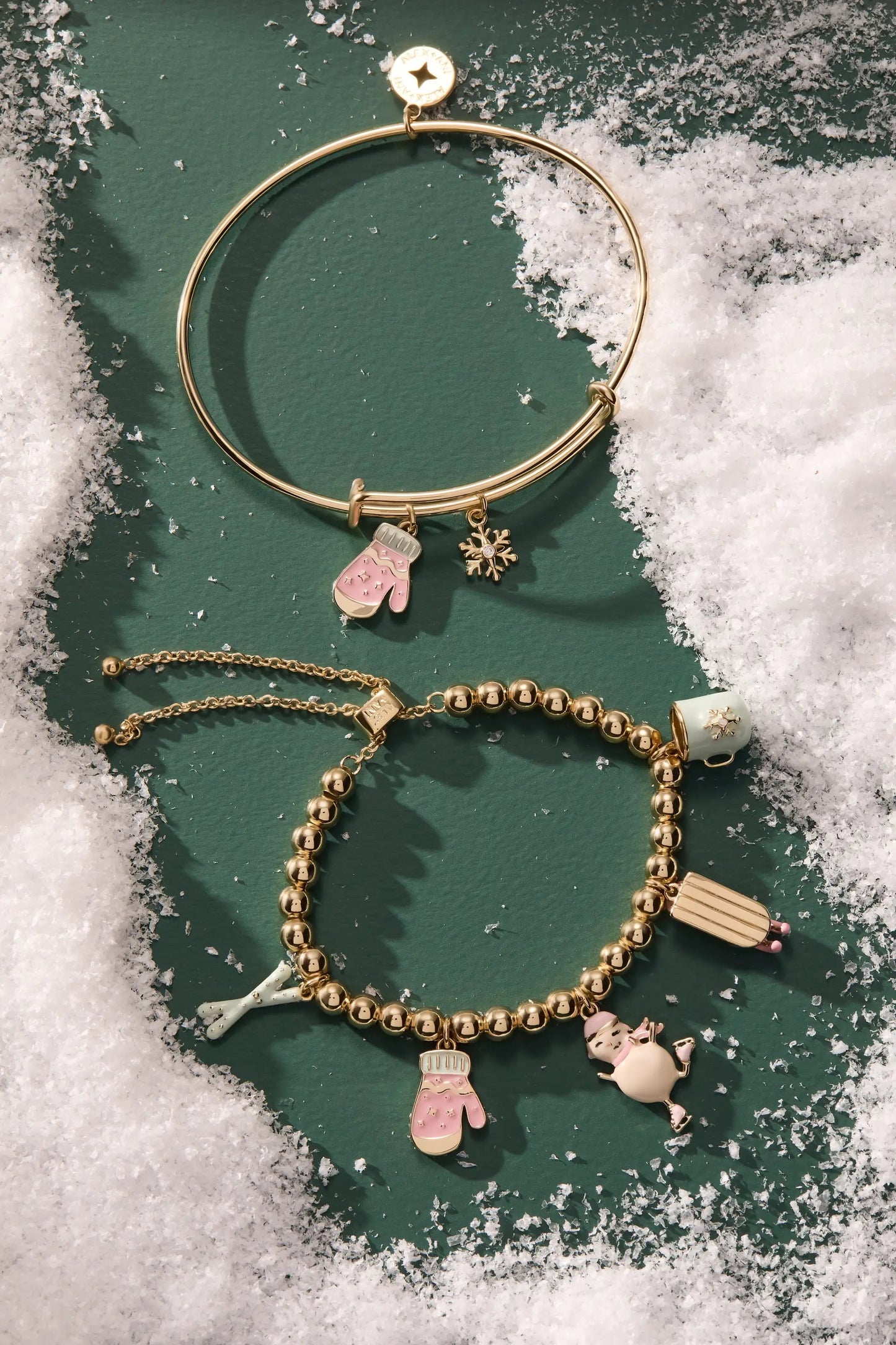 Winter Wonderland Mitten Bangle gold-tone bracelet with pink mitten and snowflake charms on Tampa Home & Garden Store