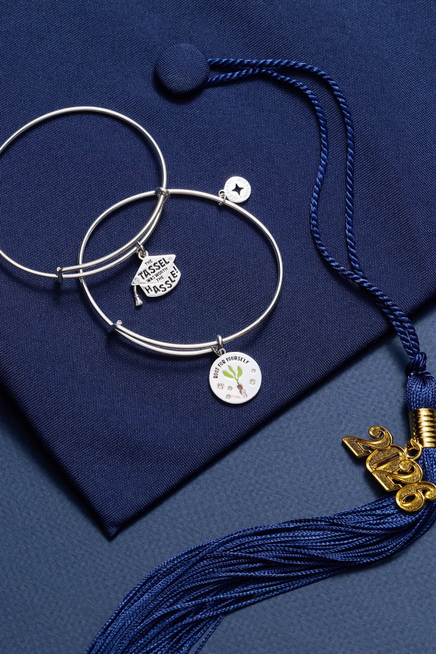 Alex and Ani Tassel Was Worth The Hassle charm bracelet with two silver bangles and blue tassel cord on Tampa Home & Garden Store