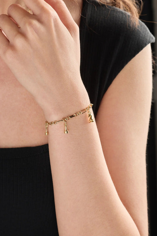 Chess Charm Bracelet by ALEX AND ANI, gold-tone bracelet with small chess charms on wrist on Tampa Home & Garden Store
