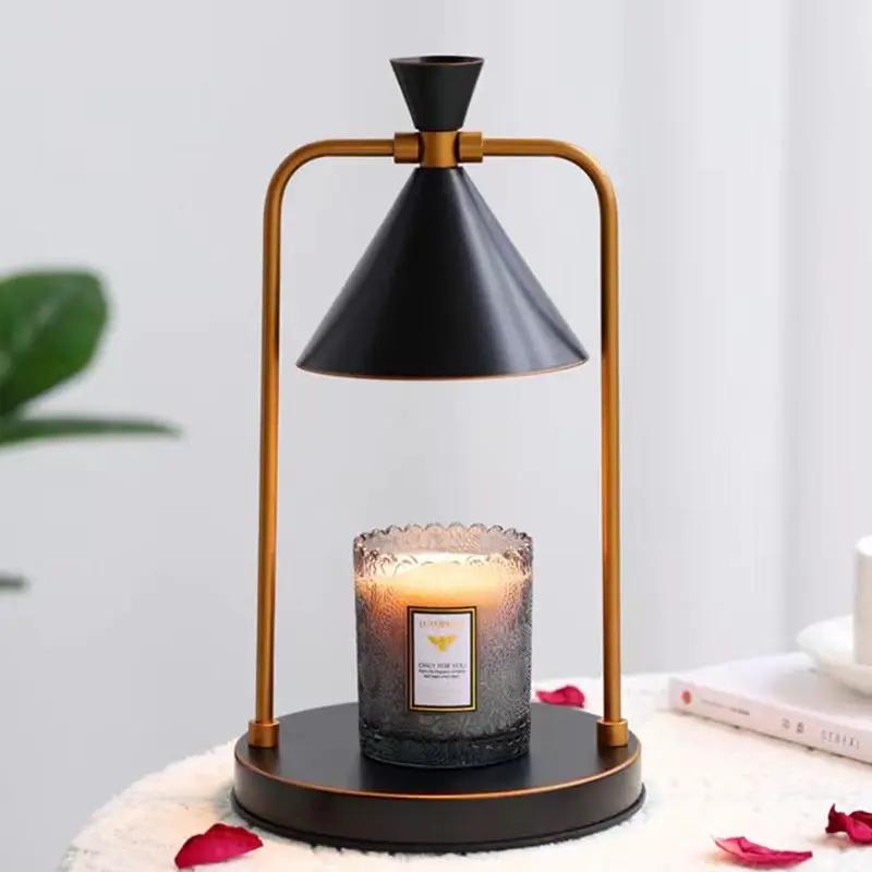 Aromatherapy desk lamp with copper frame and black cone shade over a glass candle holder on Tampa Home & Garden Store