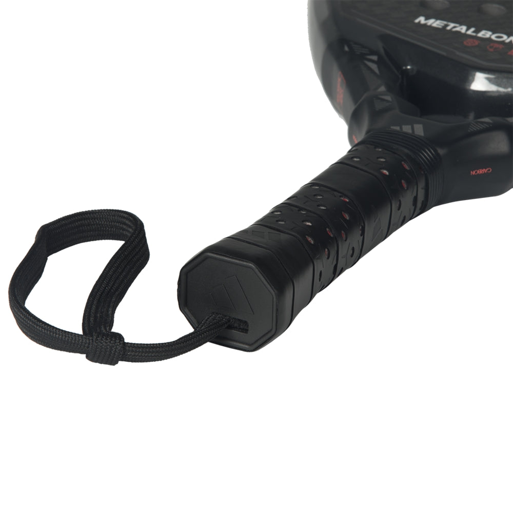 Padel racket Metalbone Carbon close-up handle with textured black grip and wrist strap on Tampa Home & Garden Store