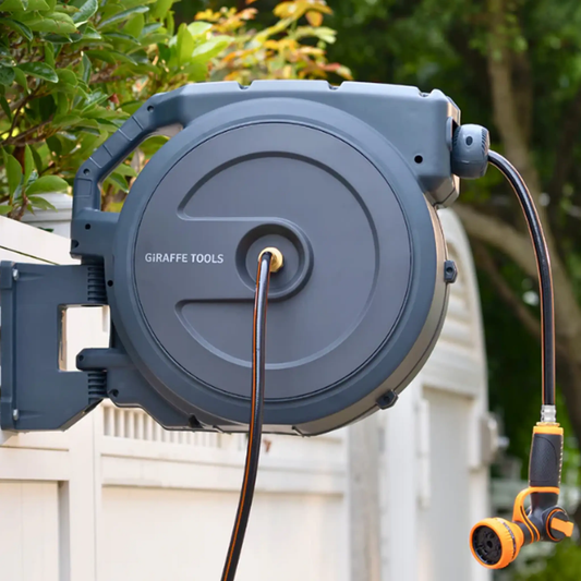 Giraffe Tools retractable garden hose reel with auto rewind, gray housing and orange hose on Tampa Home & Garden Store