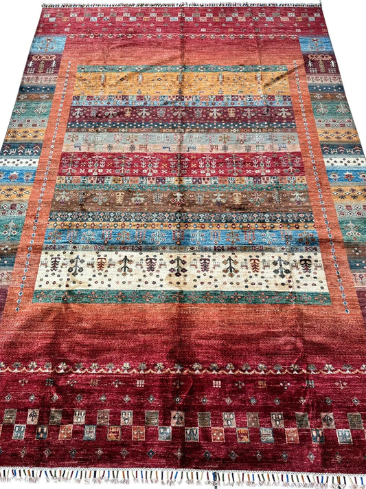 Afghani Khorjin Wool Rug, geometric tribal design with vibrant stripes and fringed ends on Tampa Home & Garden Store