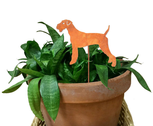 Airedale Terrier plant stake, rust-orange metal silhouette in a terracotta planter on Tampa Home & Garden Store