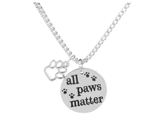 All Paws Matter necklace with two charms on a silver-tone chain, round disk and paw charm on Tampa Home & Garden Store