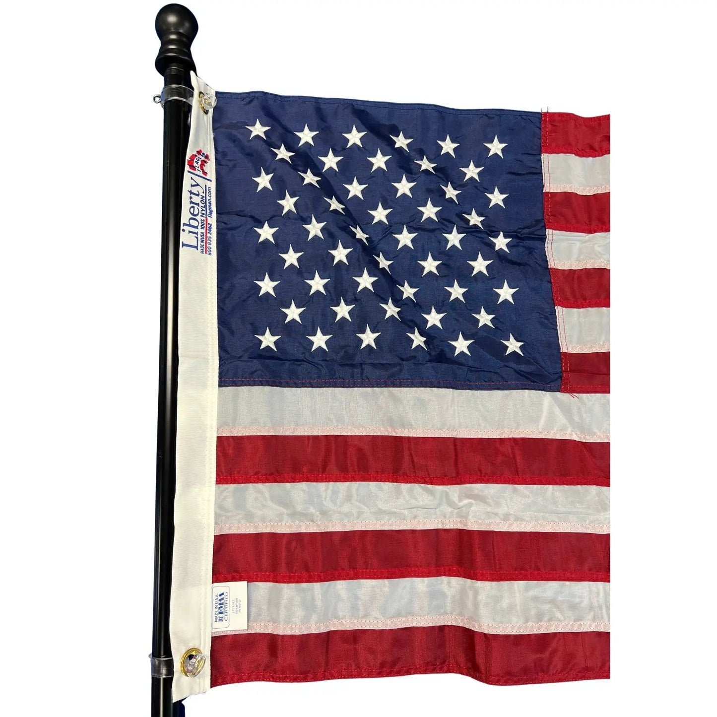 Aluminum rotating flagpole with black finish displaying US flag; Flagman of America on Tampa Home & Garden Store