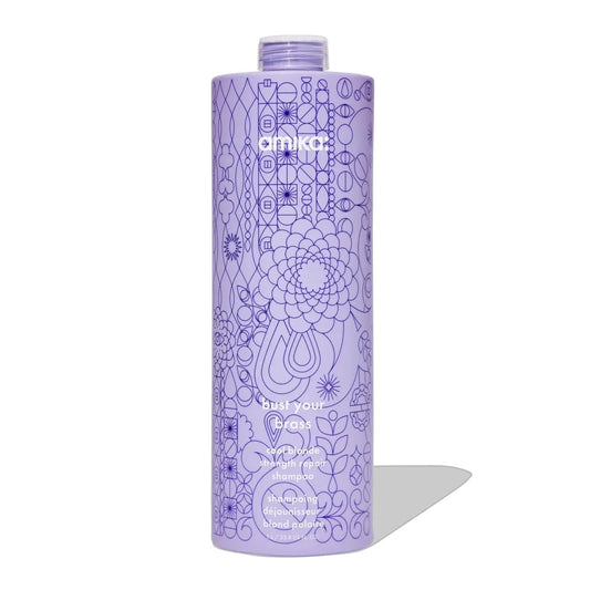 Amika Bust Your Brass Cool Blonde Repair Shampoo bottle, purple with intricate geometric pattern on Tampa Home & Garden Store